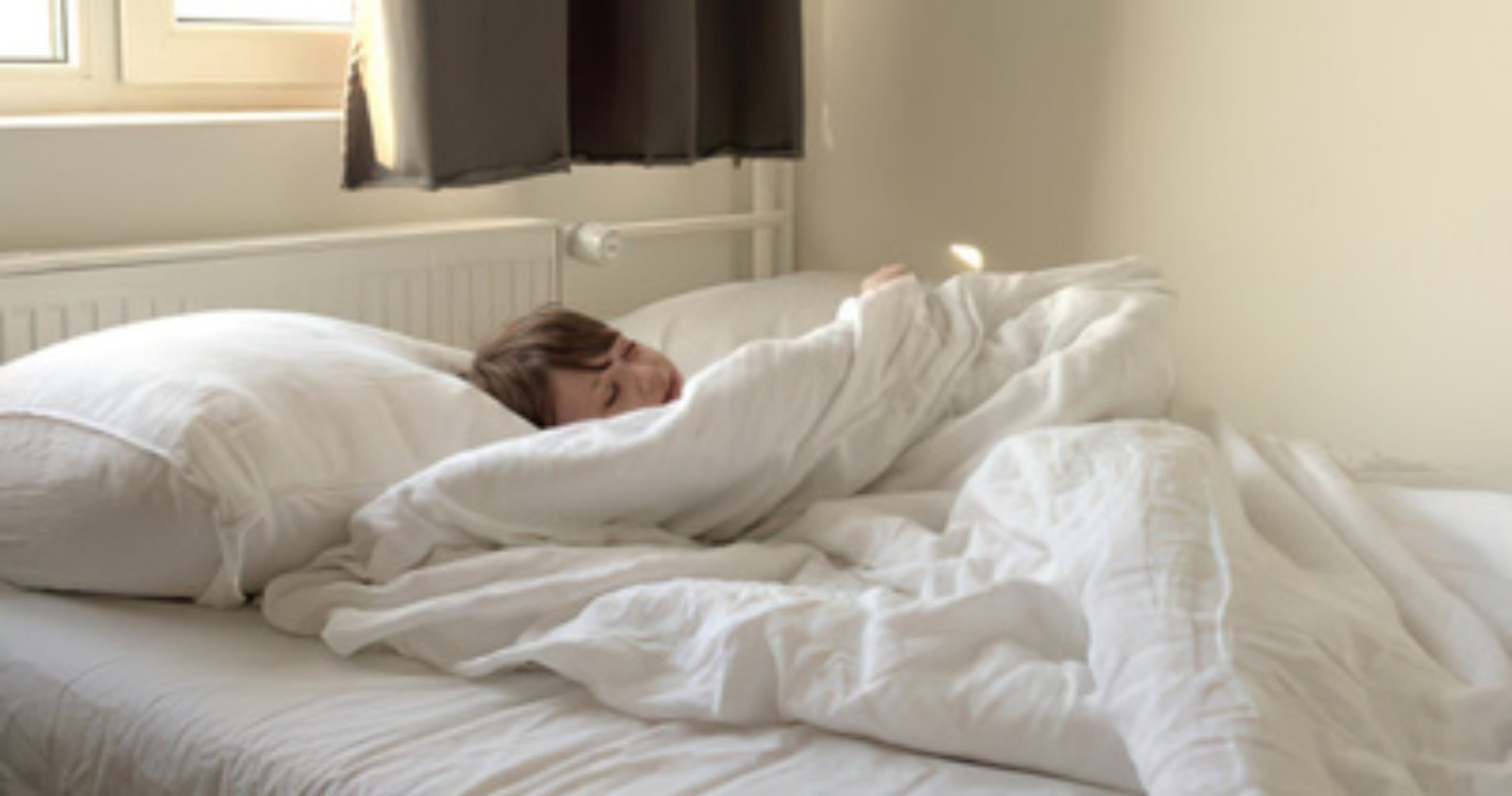 Child sleeping peacefully in bed after a settled night