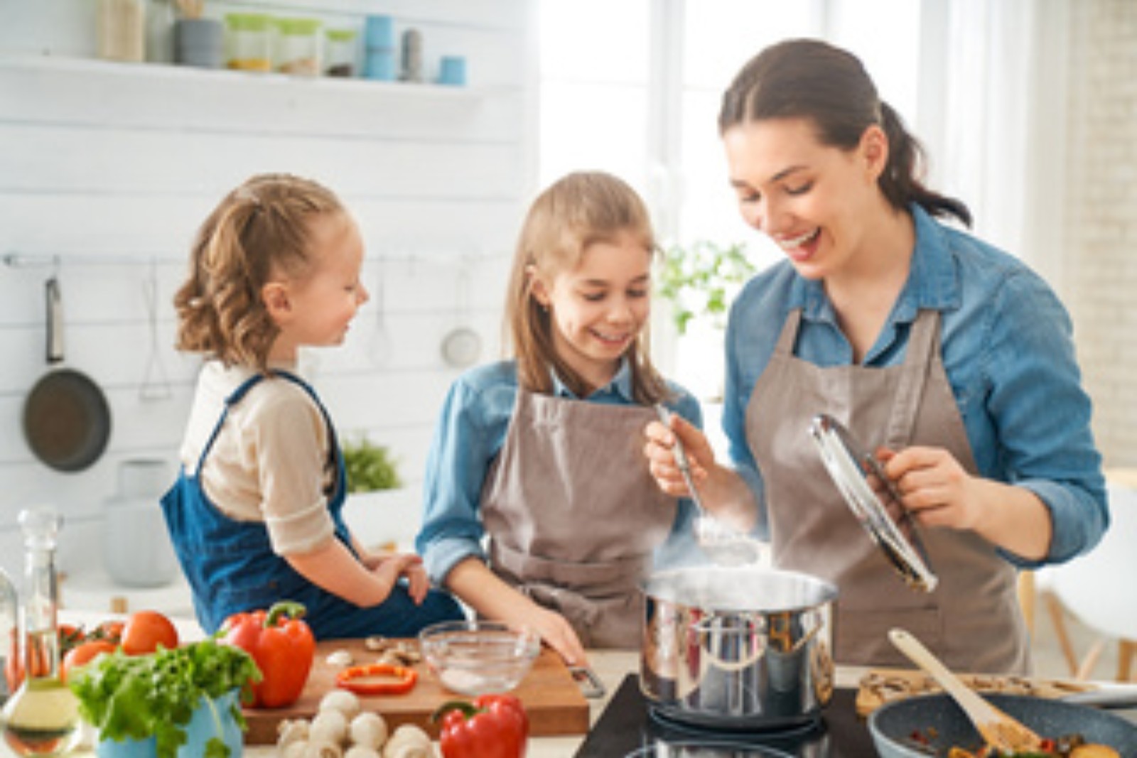 Parent and children cooking together while working out which foods cause eczema